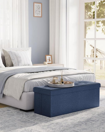 SONGMICS MAZIE Collection - 43 Inches Folding Storage Ottoman Bench, Ottoman Foot Rest, End of Bed Bench, Storage Chest, Load 660 lb, for Living Room, Bedroom, Entryway, Midnight Blue ULSF77IN